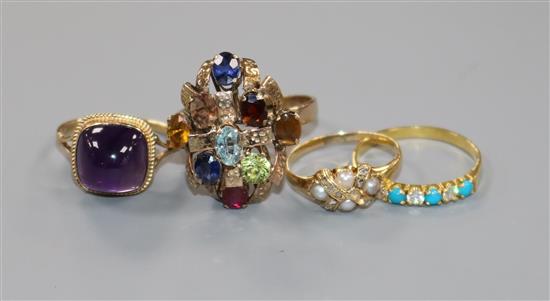 A 14ct gold and multi gem set cocktail ring and three other gem set rings including 9ct gold and amethyst.